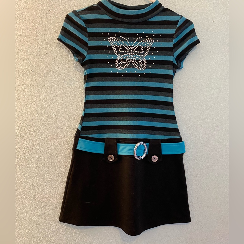 Blue and black dress with rhinestones as a butterfly.